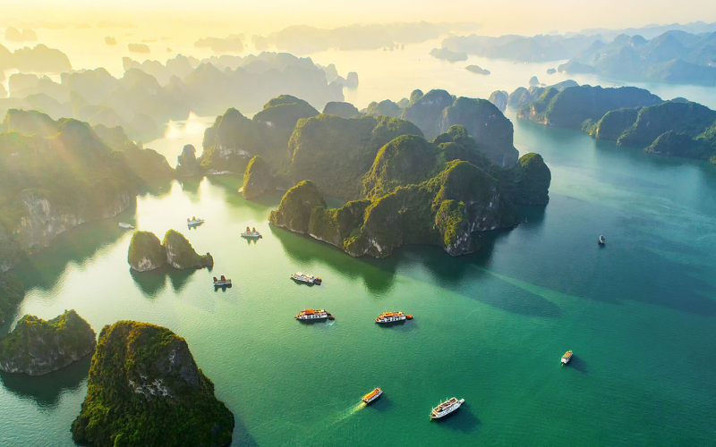 Ha Long Bay stuns travelers with emerald waters and towering limestone karsts.